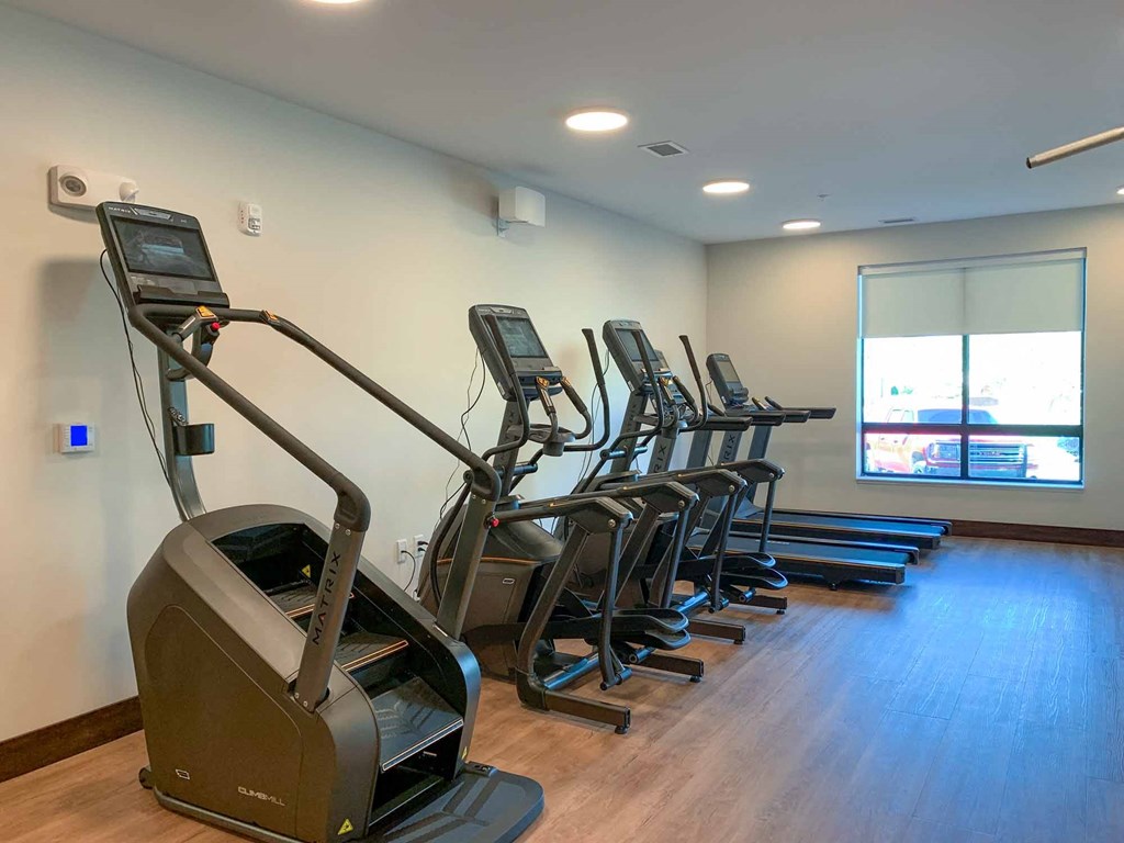The fitness center with treadmills, ellipticals, and a Stairmaster