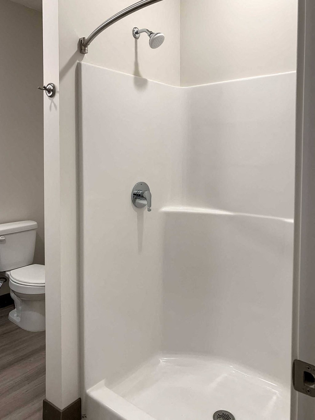 a bathroom with a walk in shower