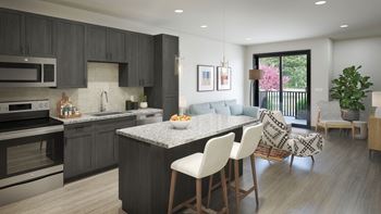 an open concept kitchen and living room with a large island with a granite countertop