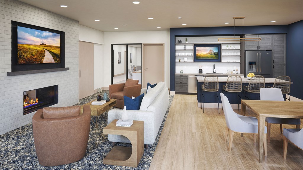 apartment clubroom with a fireplace and a kitchen in the background