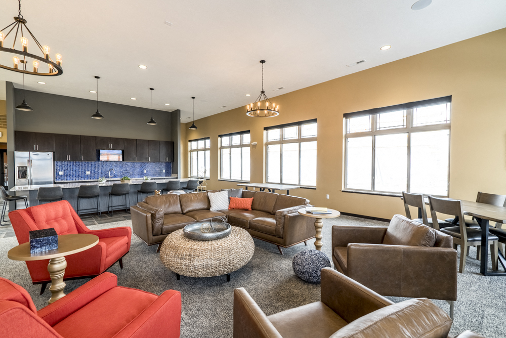 Clubhouse with seating and deluxe kitchen for entertaining at 360 at Jordan West best new apartments West Des Moines IA 50266