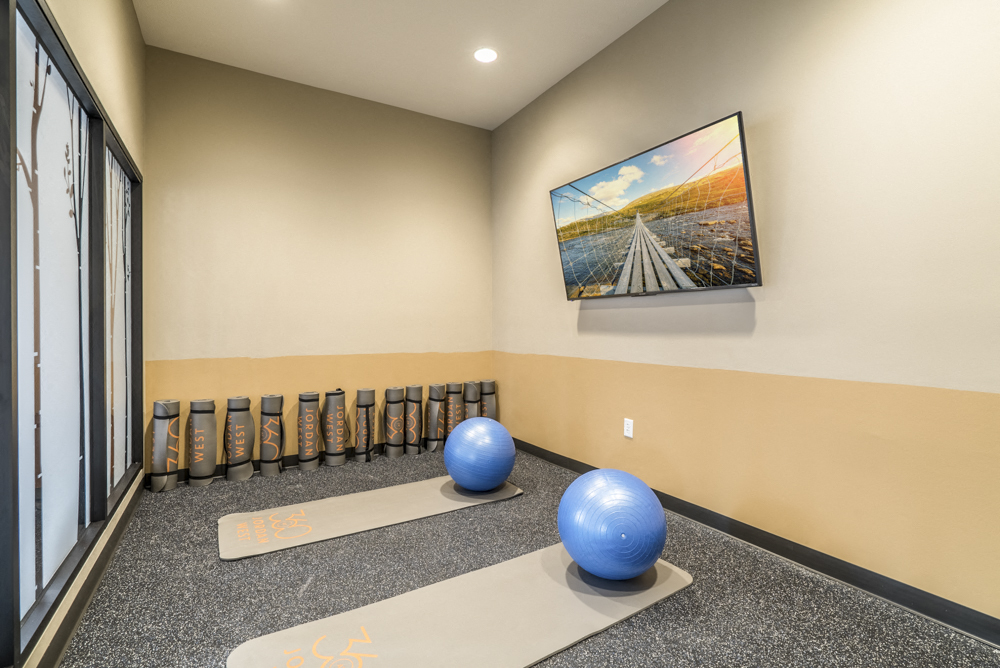 Yoga room with on-demand classes at 360 at Jordan West best new apartments West Des Moines IA 50266