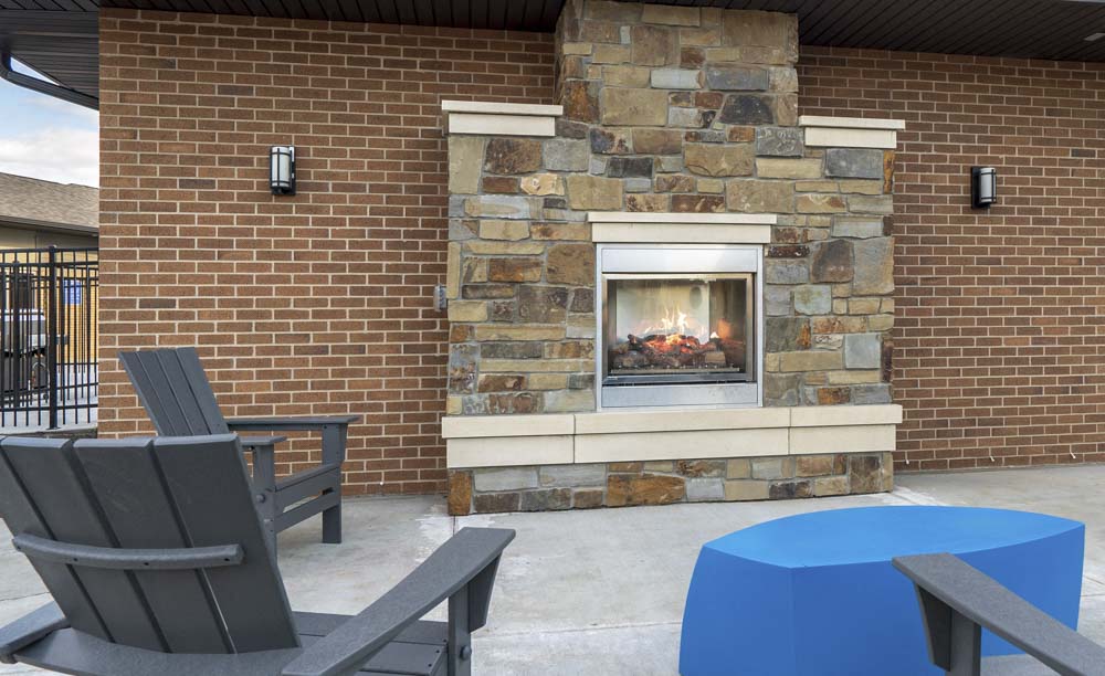 Outdoor fireplace and social lounge at 360 at Jordan West best new apartments West Des Moines IA 50266