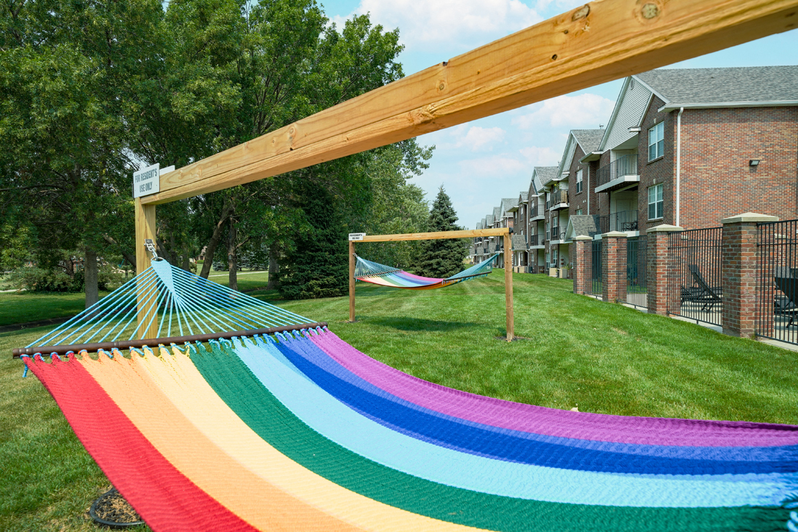 rainbow striped hammock outside the clubhouse at Williamsburg Park apartments in Lincoln