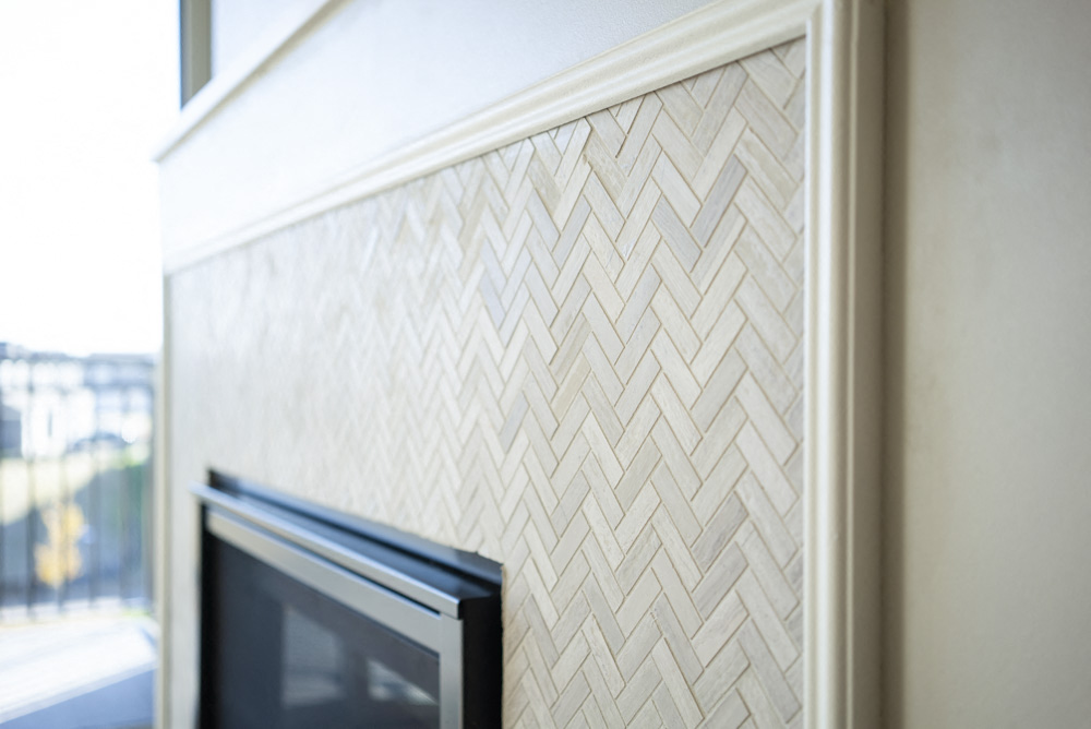 Custom designed tile surround fireplace in at Ascend at Woodbury new luxury apartments in Woodbury MN 55129