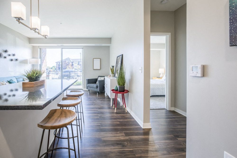 Open layout with view of living room from kitchen at Ascend at Woodbury new luxury apartments in Woodbury MN 55129
