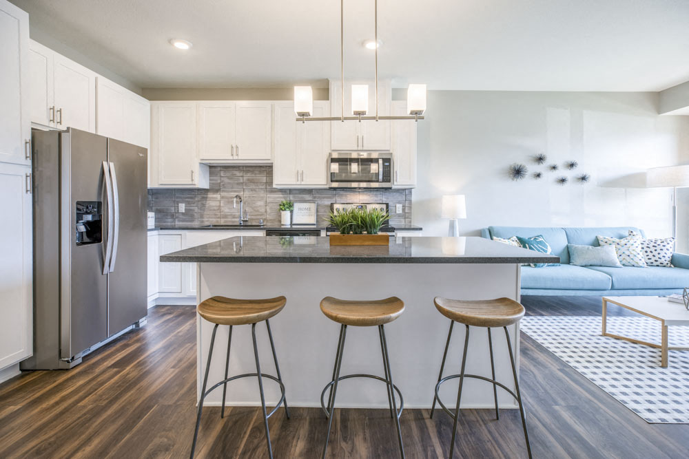Alpine design scheme with kitchen island at Ascend at Woodbury MN 55129 new luxury apartments