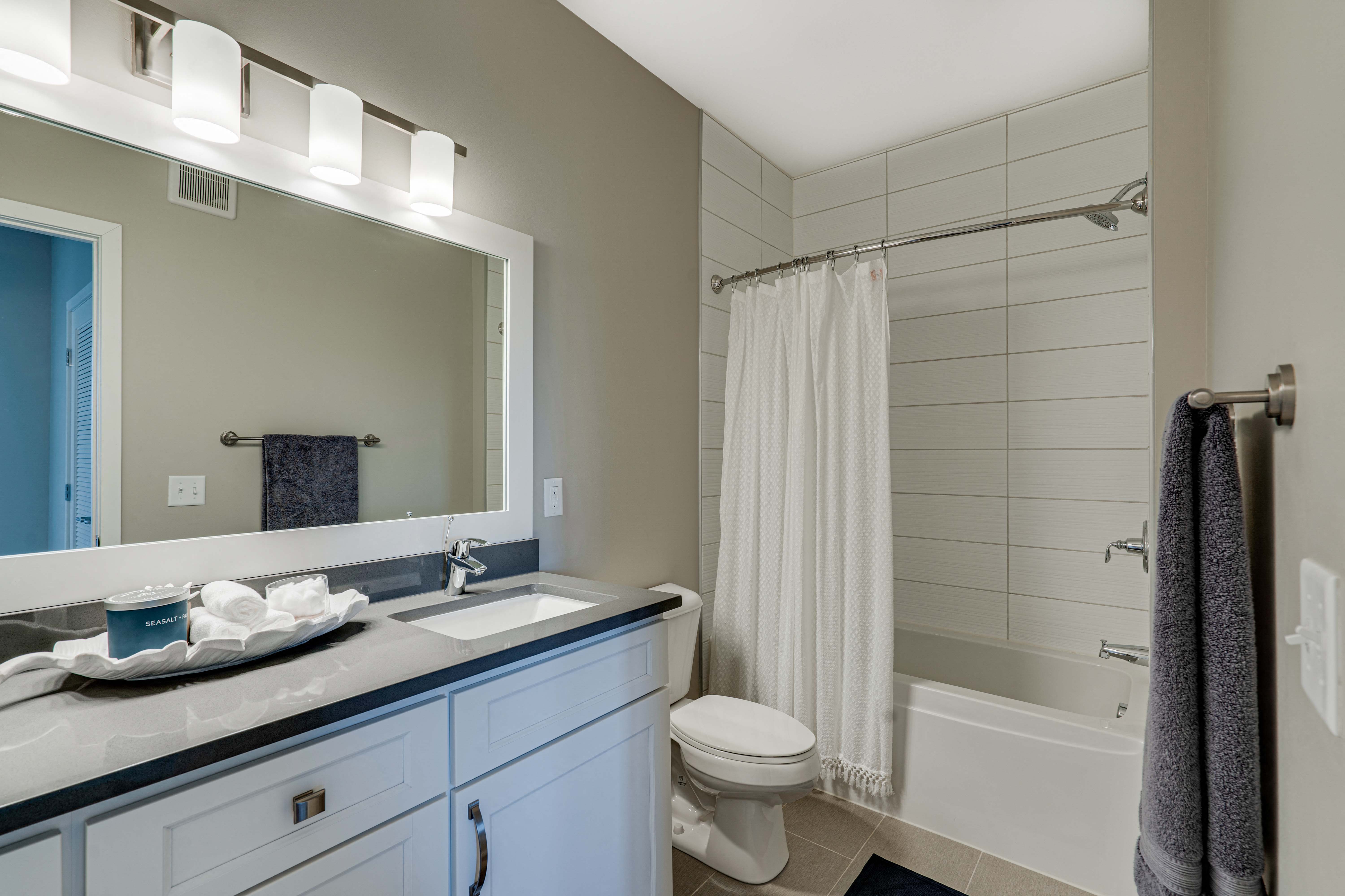 Large bathroom with tiled tub and shower surround in 2 bedroom Princeton floor plan