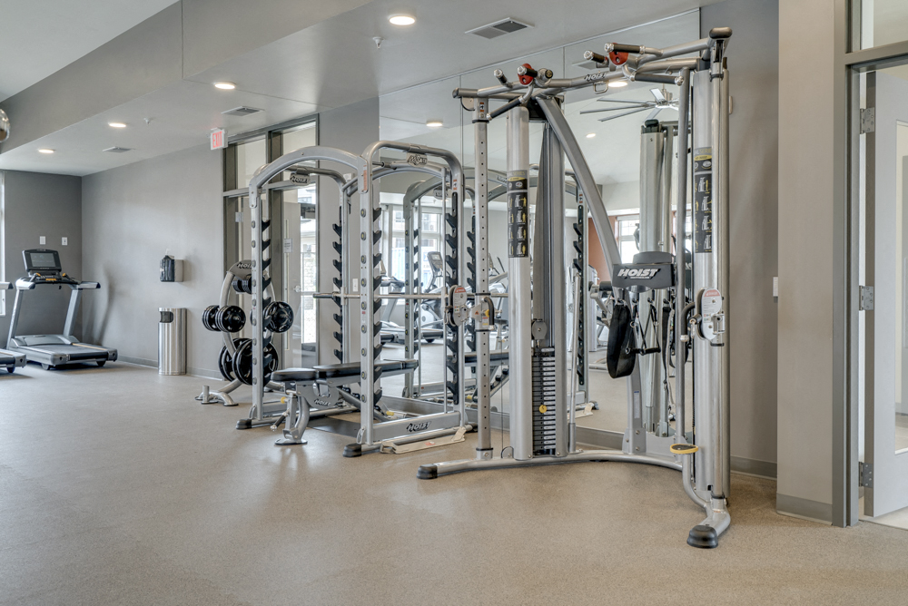 Large fitness center with free weights, weightlifting machines and cardio equipment at Ascend at Woodbury in MN
