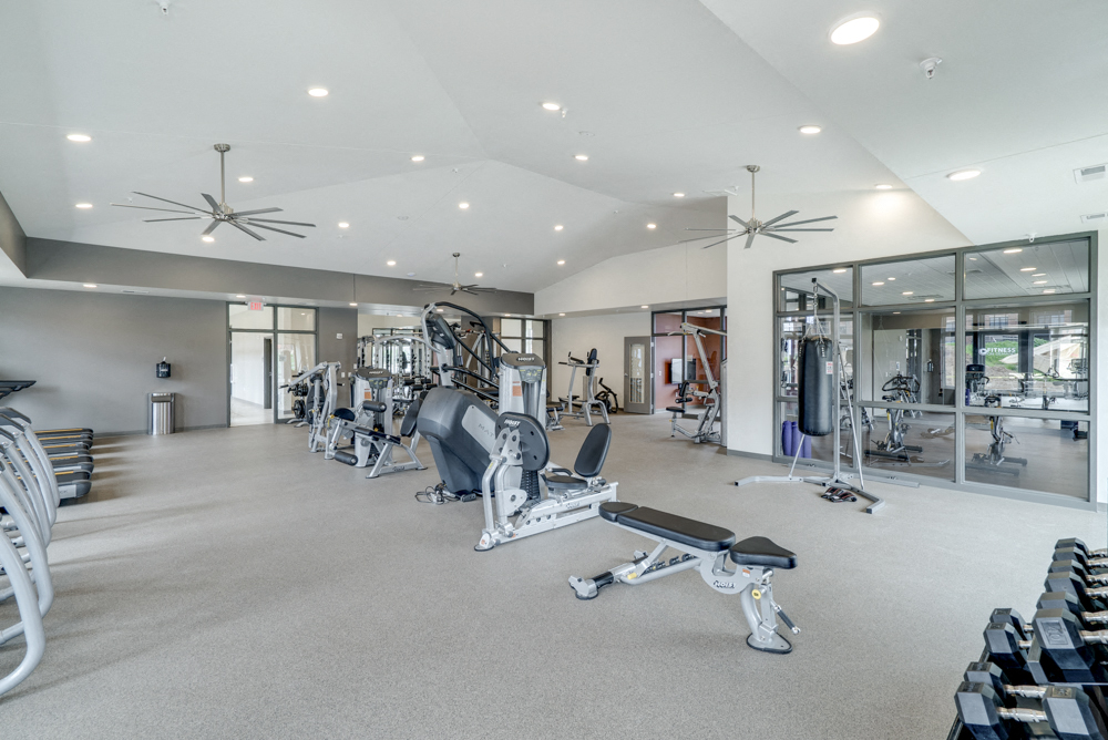 Large fitness center with free weights, weightlifting machines and cardio equipment at Ascend at Woodbury in MN