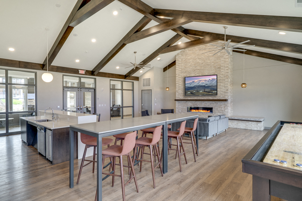 Clubhouse with seating, TV lounge and kitchen at Ascend at Woodbury MN 55129 new luxury apartments
