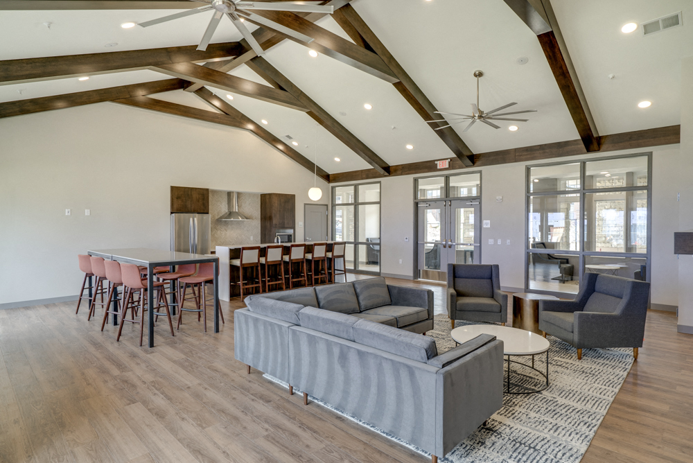Clubhouse with seating and deluxe kitchen for entertaining at Ascend at Woodbury new luxury apartments in Woodbury MN 55129