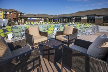 Outdoor seating by pool at Ascend at Woodbury new luxury apartments in Woodbury MN 55129