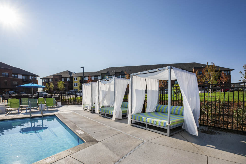 Pool with resort-style cabana seating at Ascend at Woodbury new luxury apartments in Woodbury MN 55129