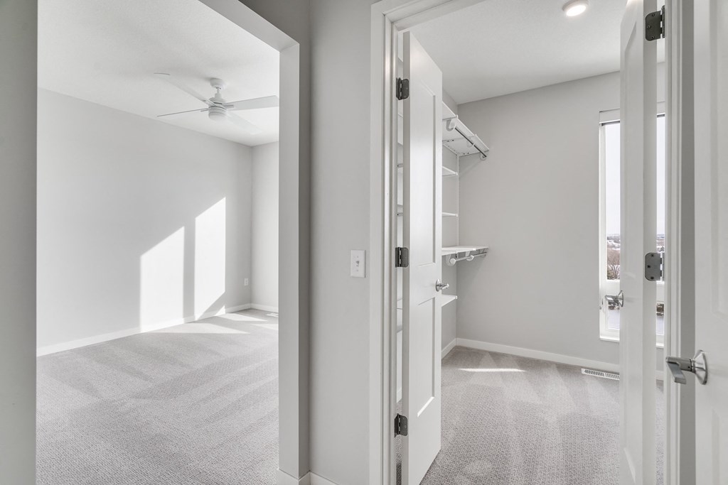 Master bedroom and large master closet with a lot of storage space at Aspire at CityPlace in Woodbury, Minnesota