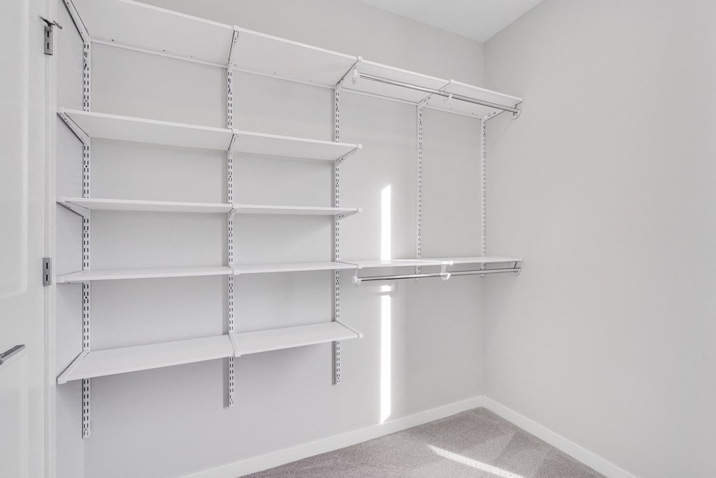 Large walk-in closet with plenty of shelving and hanging space at Aspire at CityPlace in Woodbury, Minnesota