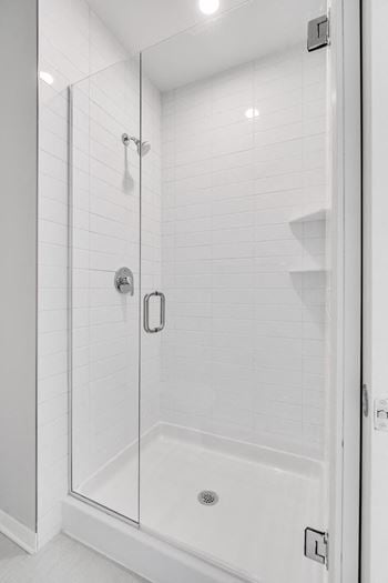 Large shower with glass door at Aspire at CityPlace in Woodbury, Minnesota