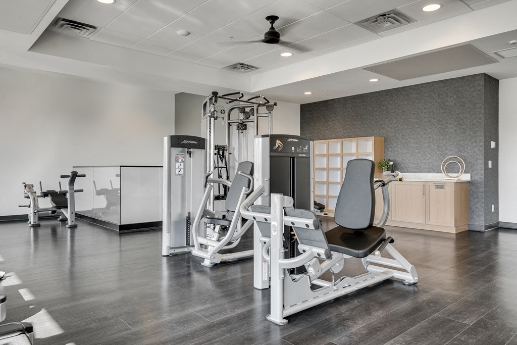 Fitness center with strength training machines at luxury apartments in Woodbury