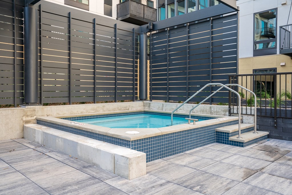 Square spa hot tub with walk in stairs at luxury apartment in Woodbury MN 55125