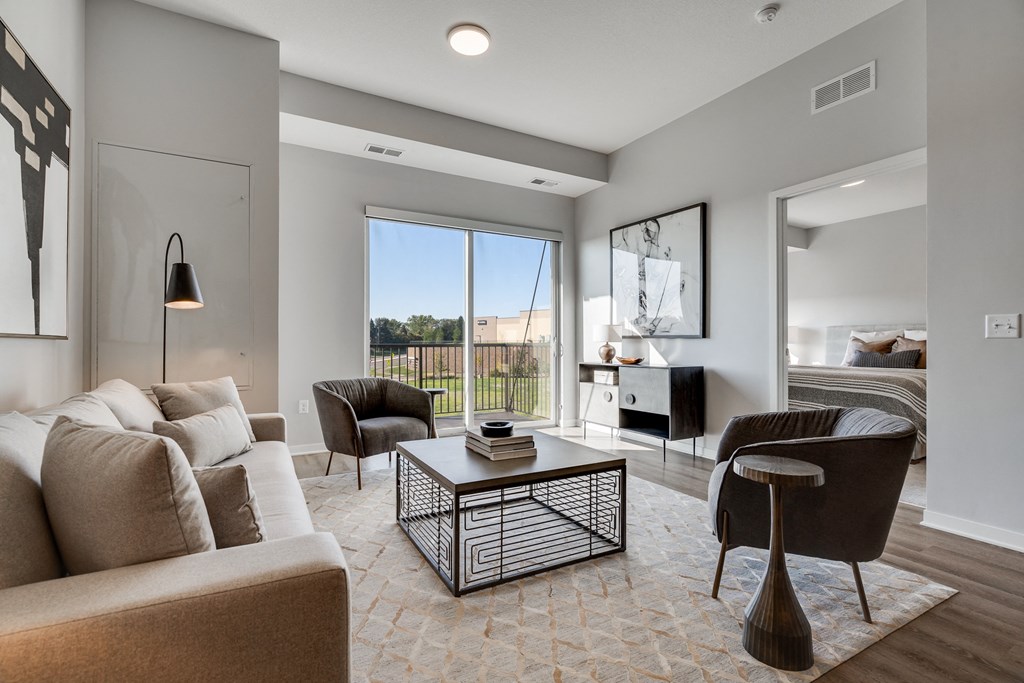 Living space with warm brown floors in luxury apartment Woodbury MN 55125