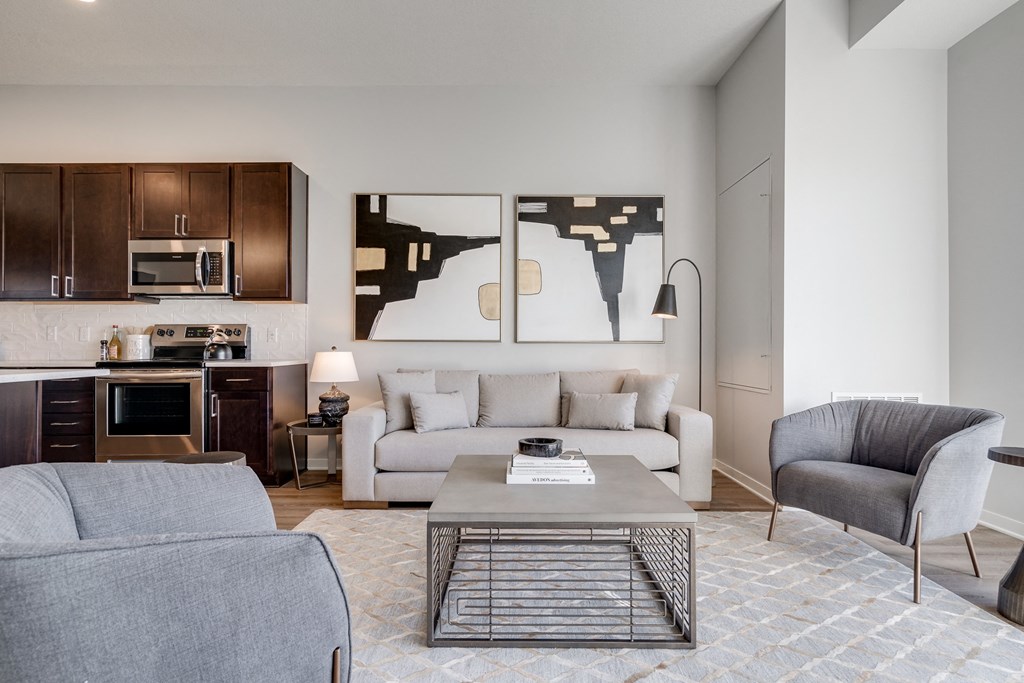 Living space with warm brown floors in luxury apartment Woodbury MN 55125