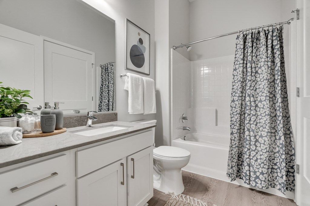 Bathroom with light counters and cabinets at luxury apartments in Woodbury MN 55125