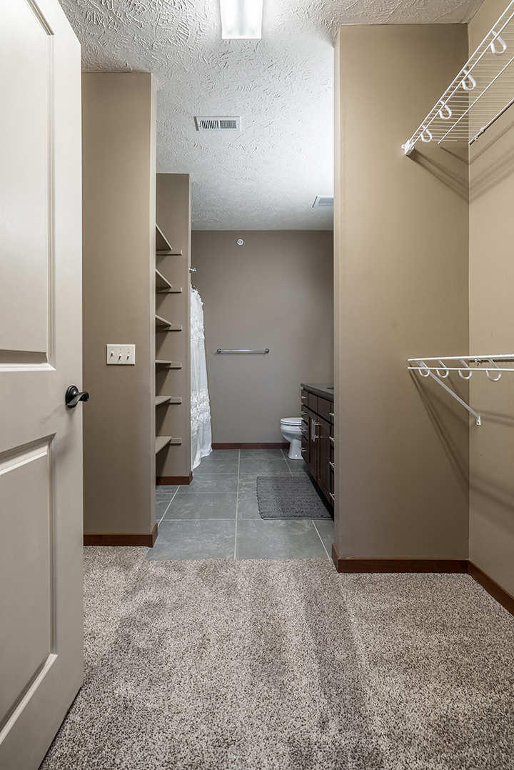 Interiors- Bathroom attached to expansive walk-in closet at the Villas of Omaha Butler Ridge in Omaha NE