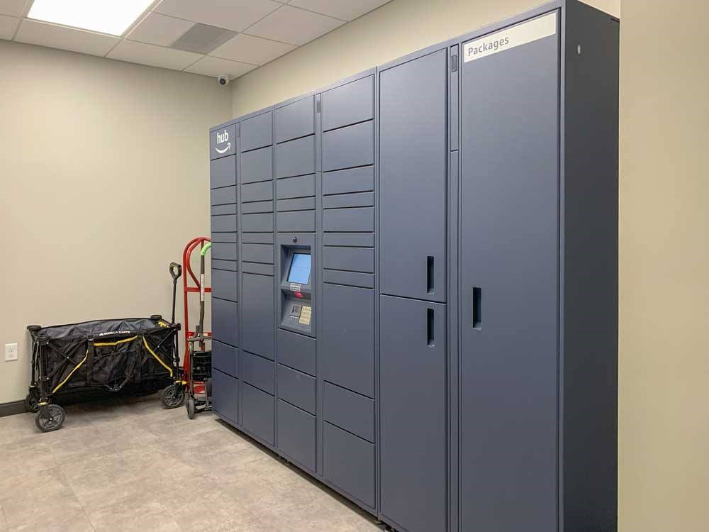 a room with amazon branded electronic package lockers