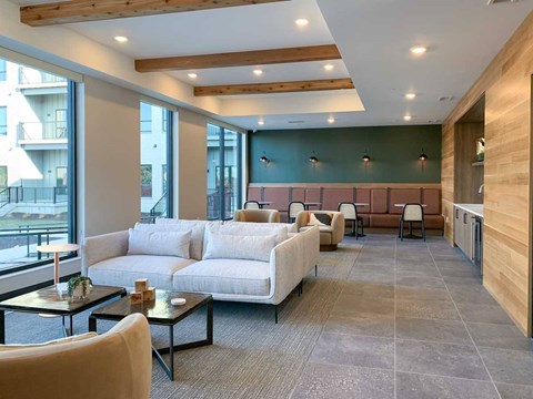 A modern living room with a large couch and a coffee table.
