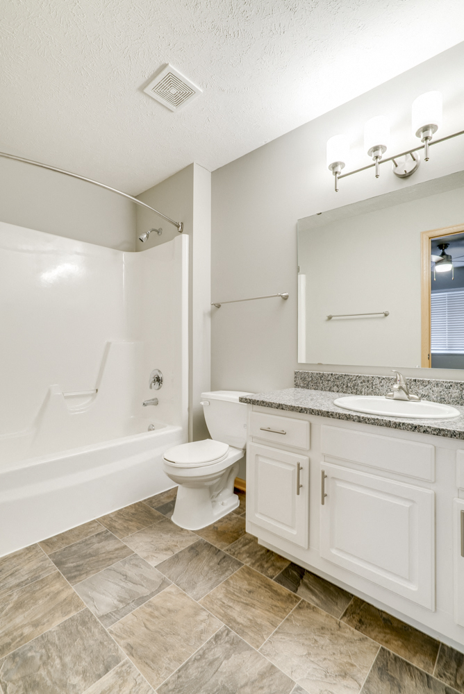 Bathroom with white cabinetry at Cascade Pined Duplex and townhomes