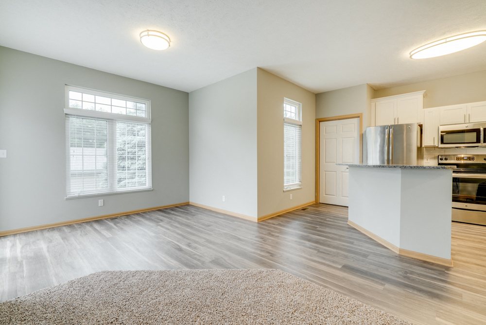 Open floor plan with kitchen and living room at Cascade Pines Duplex and townhomes
