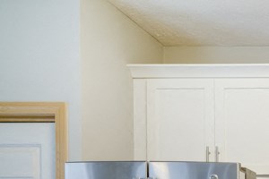 Kitchen Kitchen with stainless steel appliances, light granite countertops, and while cabinetry at Cascade Pines Duplex and Townhomes