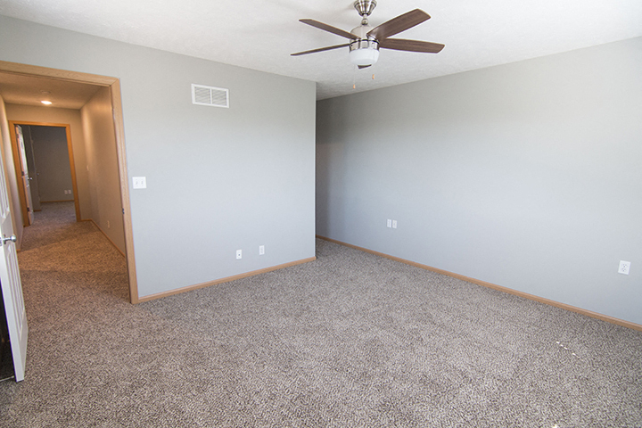 Large bedroom with lots of natural lighting at Cascade Pines Town-homes Lincoln Nebraska