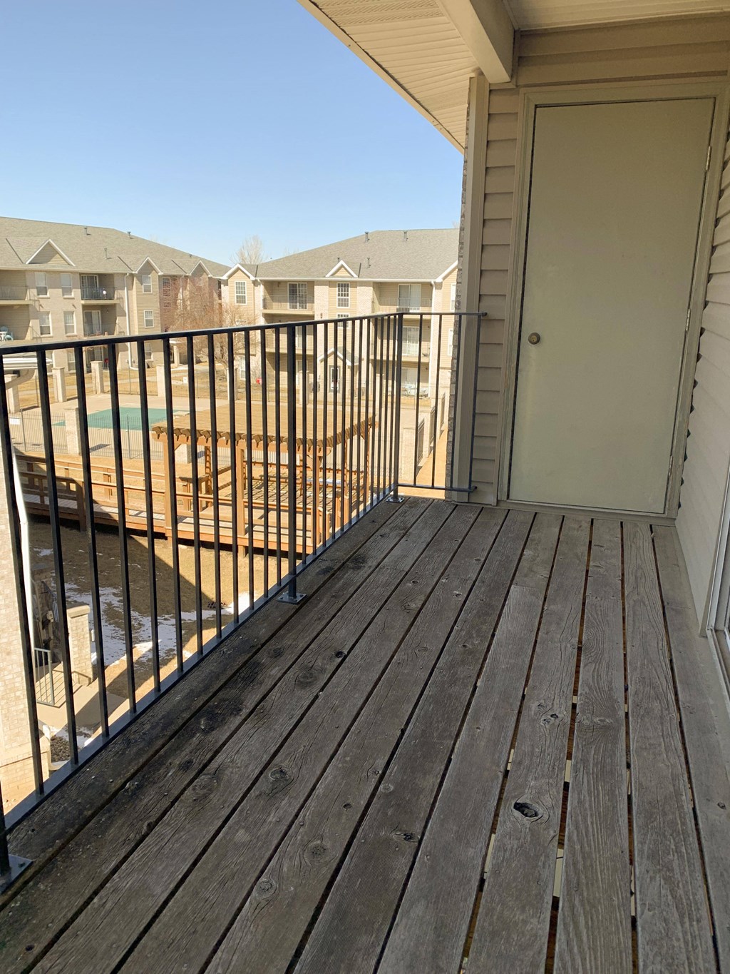 balcony overlooking community swimming pool at Eagle Run Apartments in Omaha Nebraska