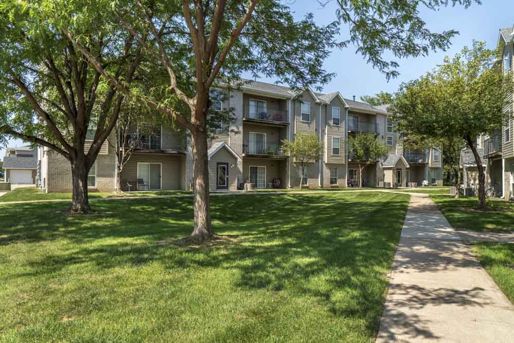 Walkway with greenspace to Eagle Run Apartments in northwest Omaha 68164