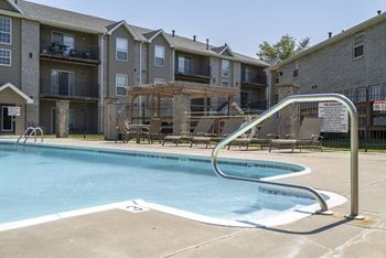 Outdoor pool with view of pergola at Eagle Run Apartments in northwest Omaha 68164