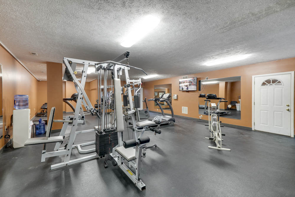 Fitness center with weightlifting machines and cardio equipment at Eagle Run Apartments in northwest Omaha 68164