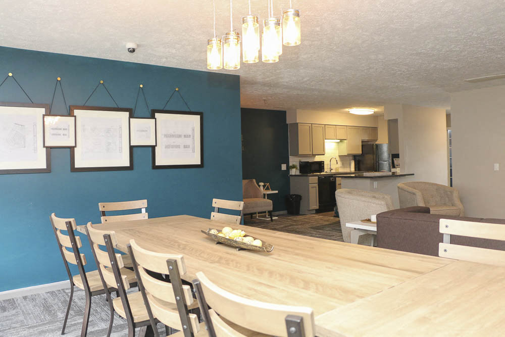 Large table in the clubhouse at Eagle Run Apartments in Omaha NE