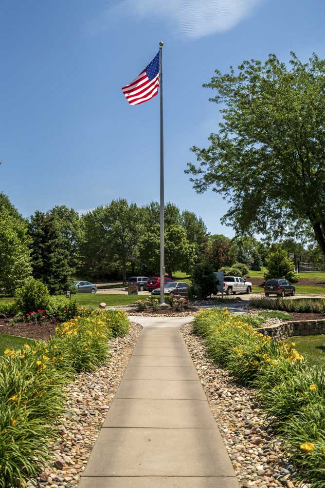 Flag pole with the United States Flag at Fountain Glen Apartments