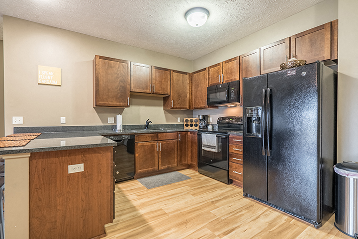 Interiors- Hardwood-like flooring in the kitchen at the Villas of Omaha Butler Ridge in Omaha NE