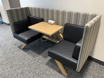 Booth with two seats, and table and outlets for working from home