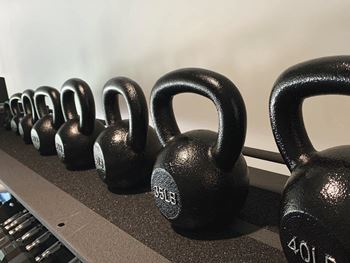 Kettle bells in multiple weights in the fitness center at Haven at Uptown