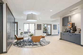 a large room with a table and chairs