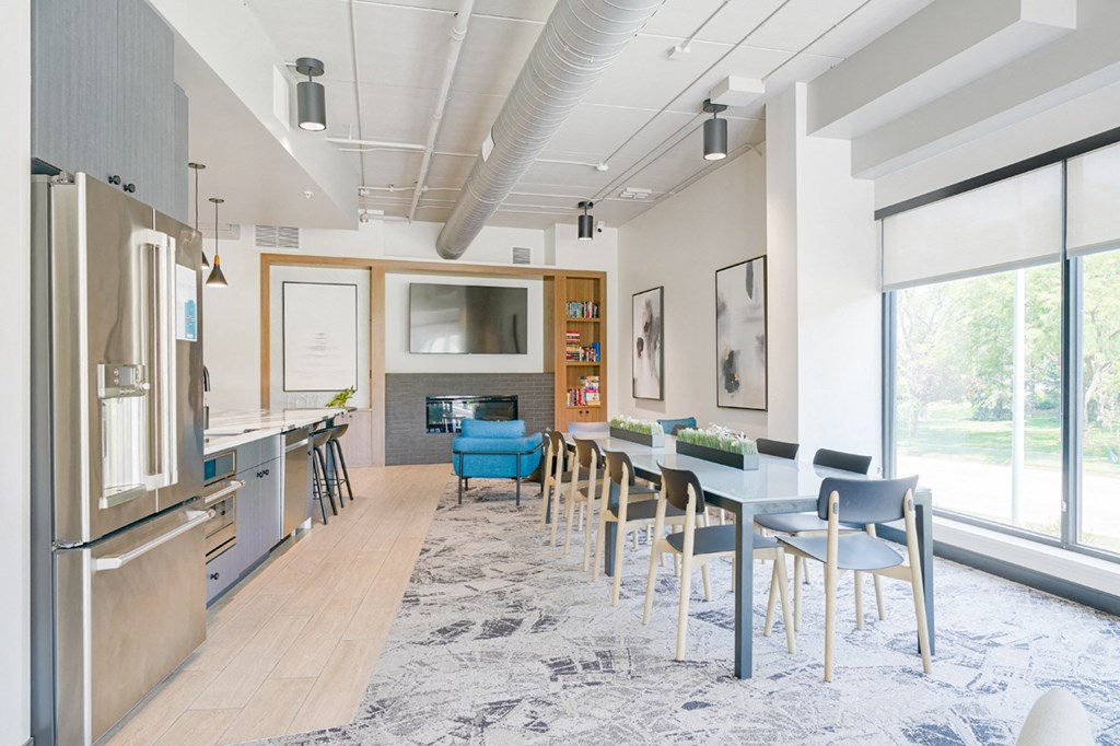 a kitchen and dining room with a blue table and chairs