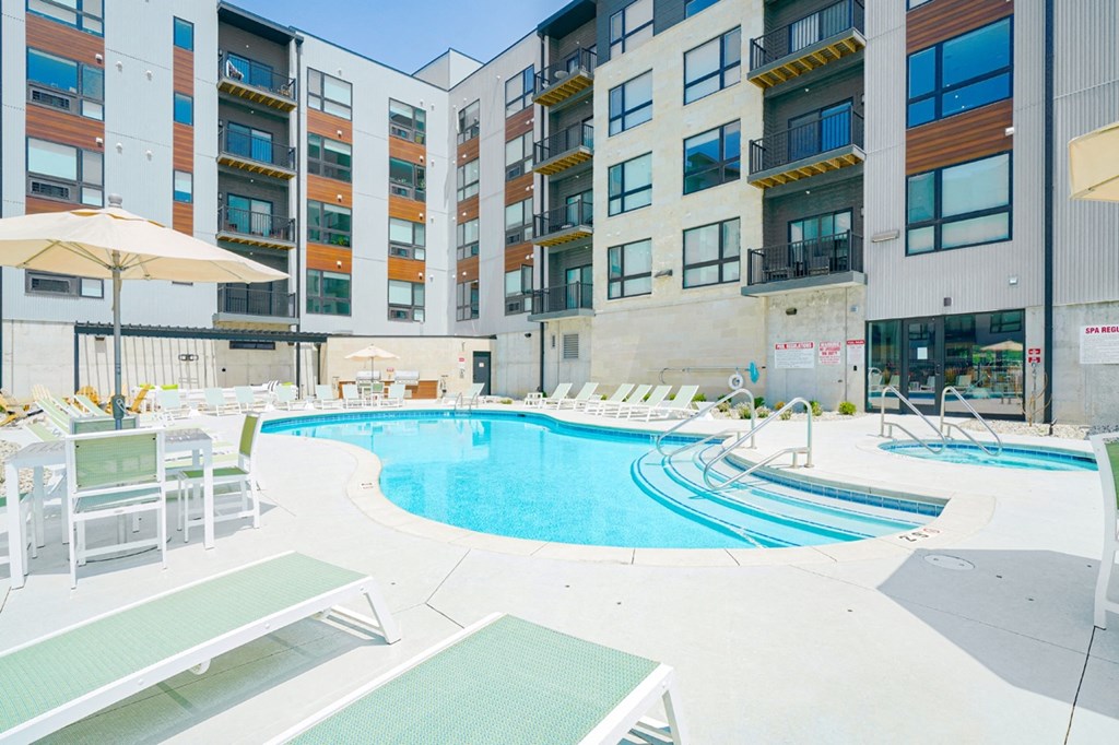 a swimming pool in front of Haven at Uptown apartments