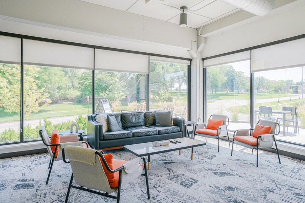the preserve at ballantyne commons living room with furniture and large windows