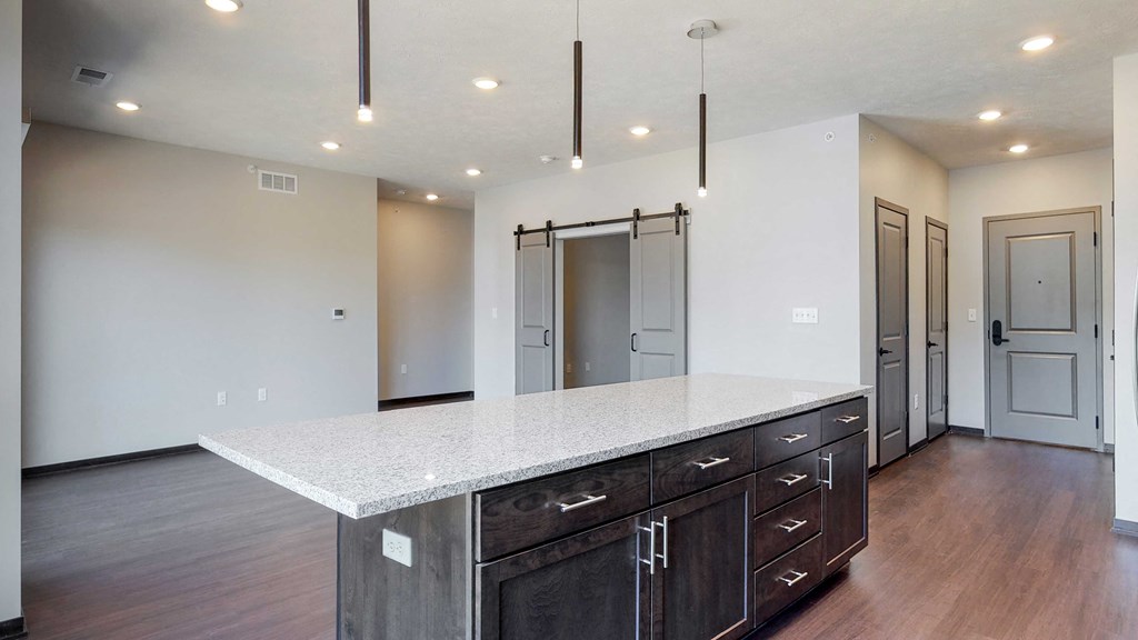 Beautiful kitchen island which provides plenty of extra storage with the additional cabinet space provided at Haven at Uptown in Lincoln, NE