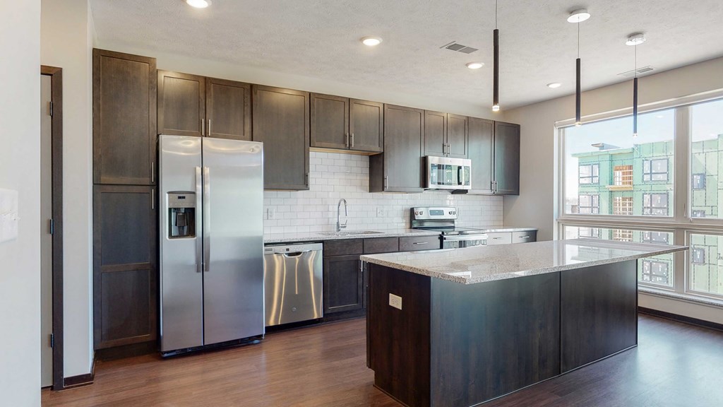 Beautiful kitchen island which provides plenty of extra storage with the additional cabinet space provided at Haven at Uptown in Lincoln, NE