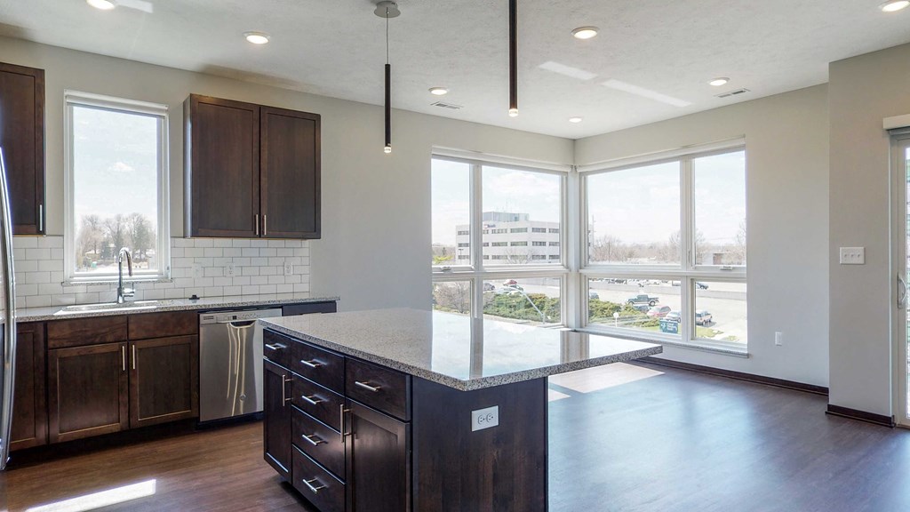 Kitchen and living space with abundant natural light at Haven at Uptown in Lincoln, NE