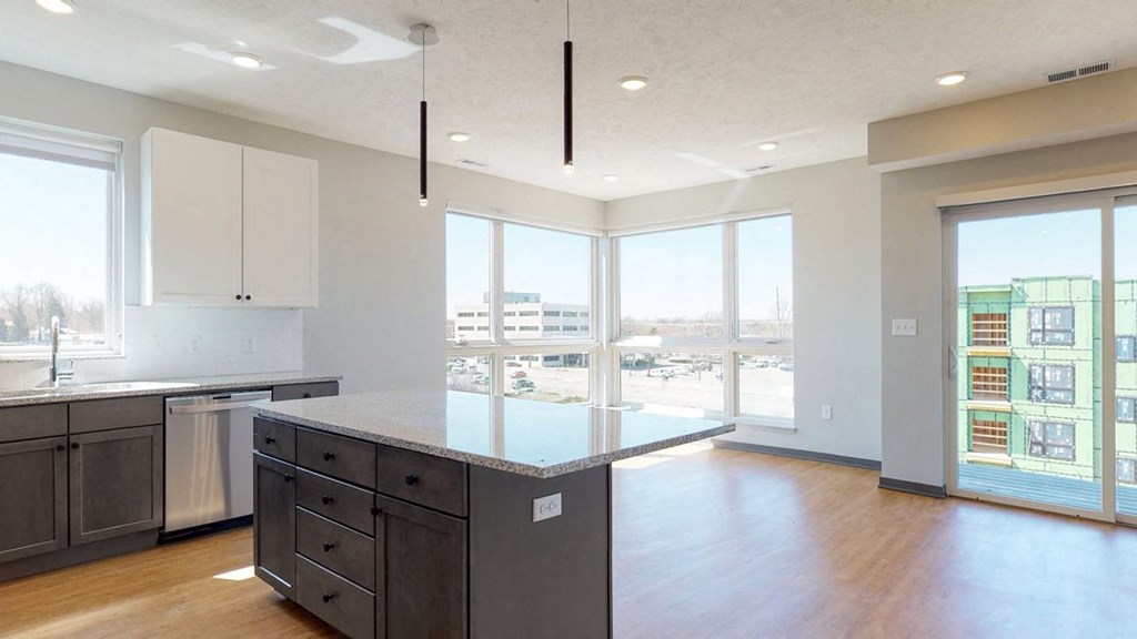 Open concept kitchen and living-dining space in the Shine floor plan at Haven at Uptown in Lincoln, NE